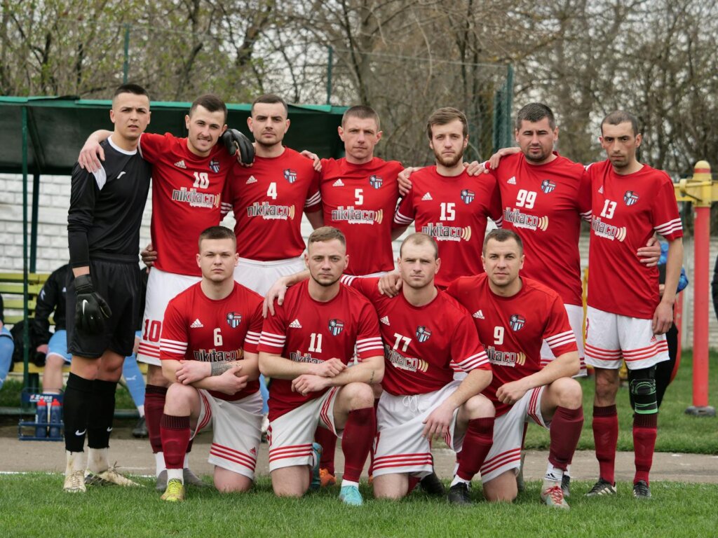 Footballers Posing Together Before Match