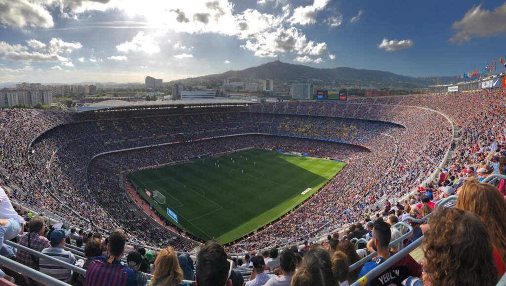 a stadium full of people watching a soccer game