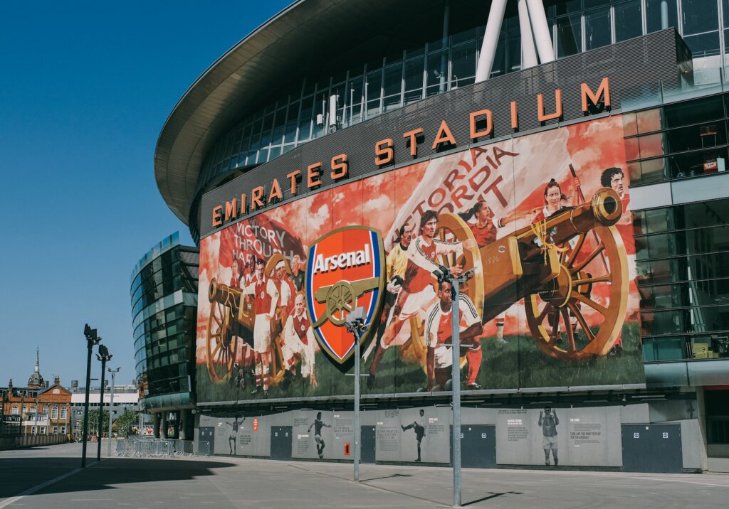 a stadium with a large mural on the side of it arsenal