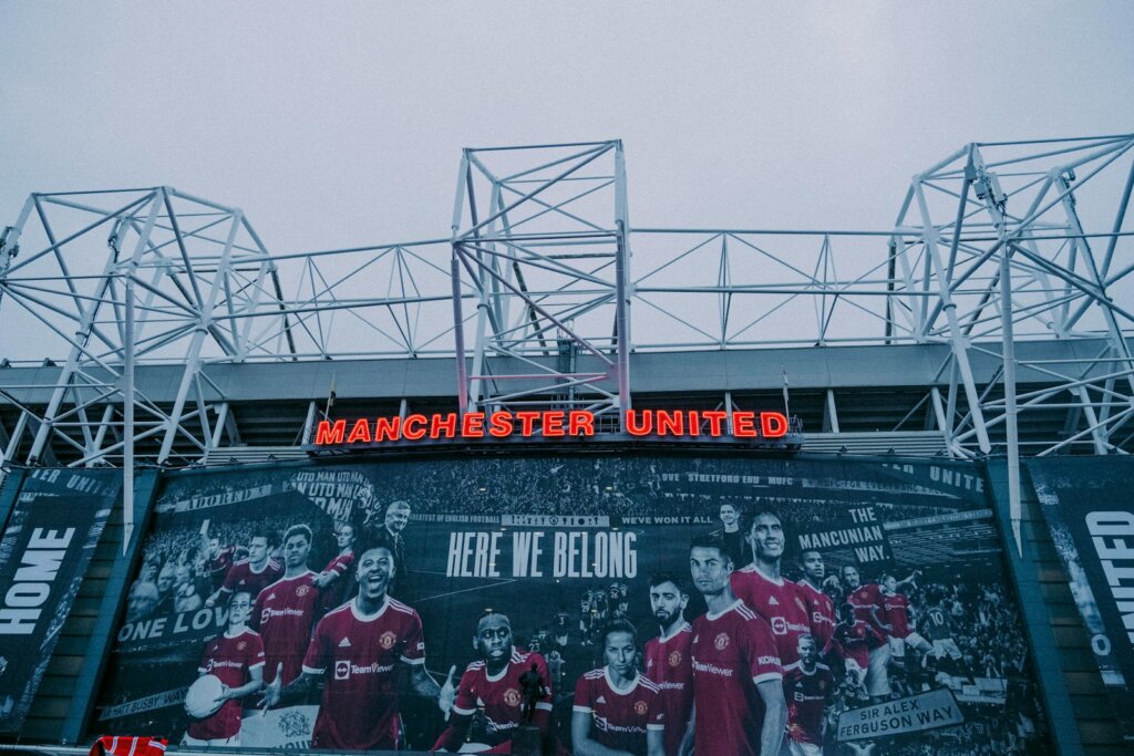 a large sign on the side of a building manchester united