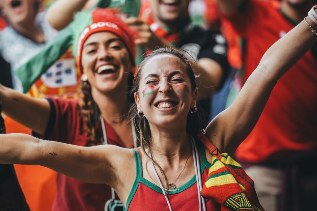 Smiling Sport Supporter with Flags on Cheeks