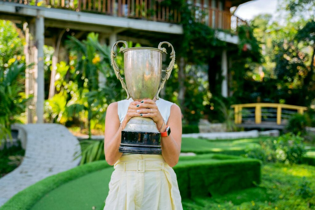 A Woman Holding a Trophy